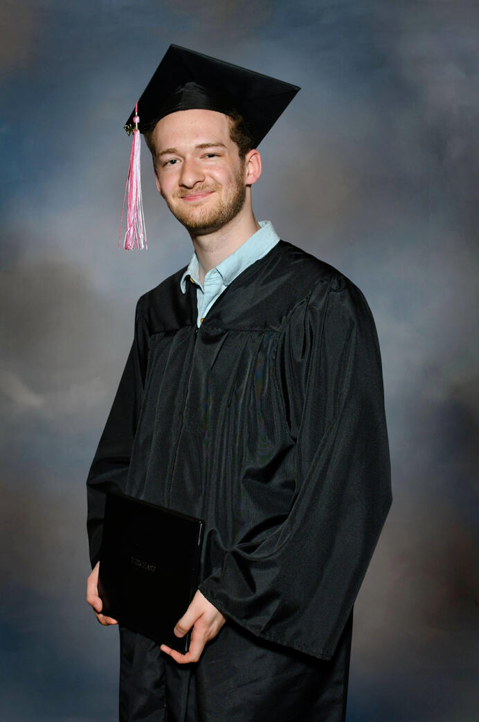 Holding my degree immediately after the SUNY Purchase College Graduation Ceremony, 5/15/26